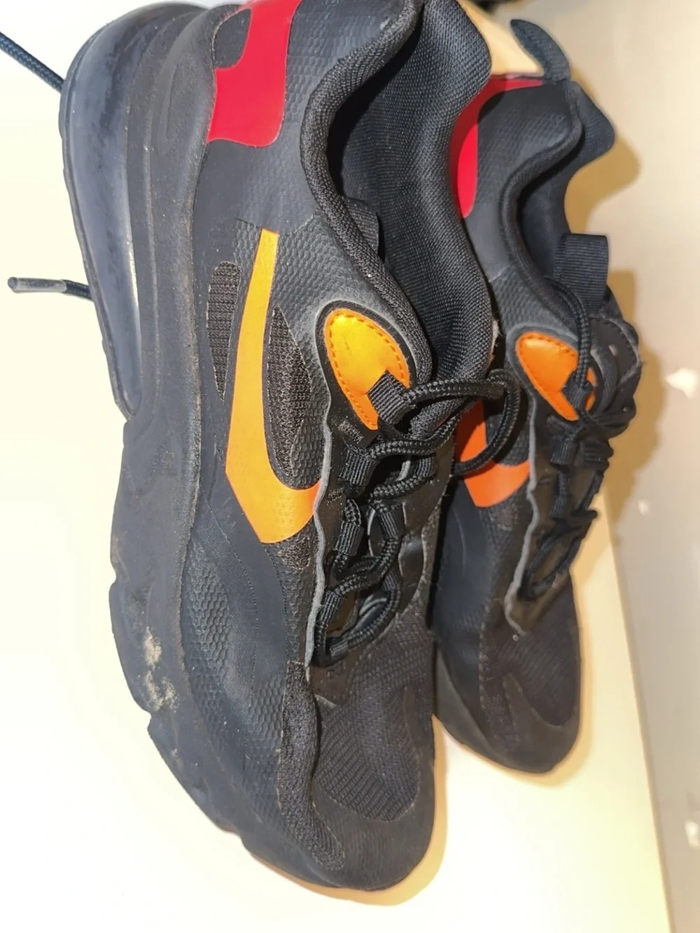Nike Kids Black Sneakers with Orange and Red Accents